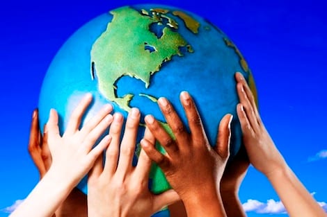 Hands on a globe --- Image by © Royalty-Free/Corbis
