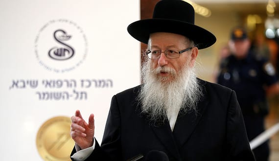 Israeli Health Minister Yaakov Litzman speaks during a briefing to members of the media on the medical condition of former Israeli President Shimon Peres a day after he suffered a stroke, at a hospital near Tel Aviv