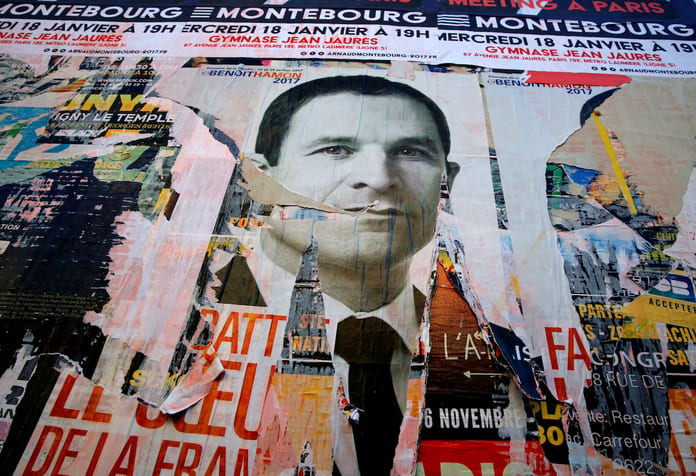 A campaign poster for Benoit Hamon, candidate in the French Socialist party presidential primaries, is seen on a wall in Paris