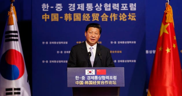 Chinese President Xi Jinping delivers a speech during the Korea China Investment Forum at a hotel in Seoul