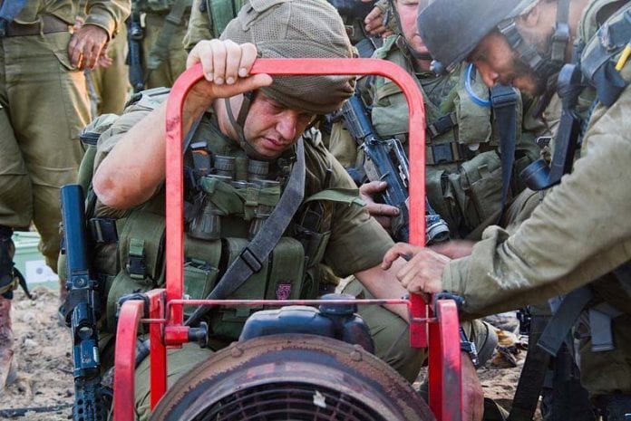 Ofer-Vinter-exposing-a-tunnel-in-the-Gaza-Strip-during-the-2014-War-696x465