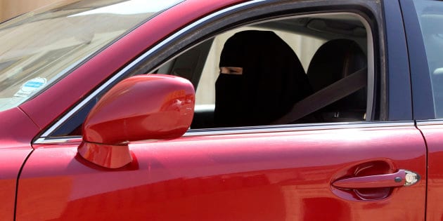 A woman drives a car in Saudi Arabia