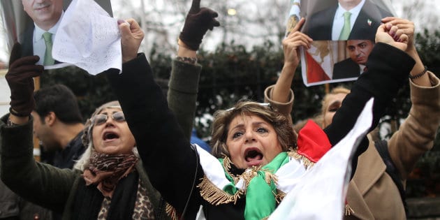 Opponents of Iranian President Hassan Rouhani hold a protest outside the Iranian embassy in west London