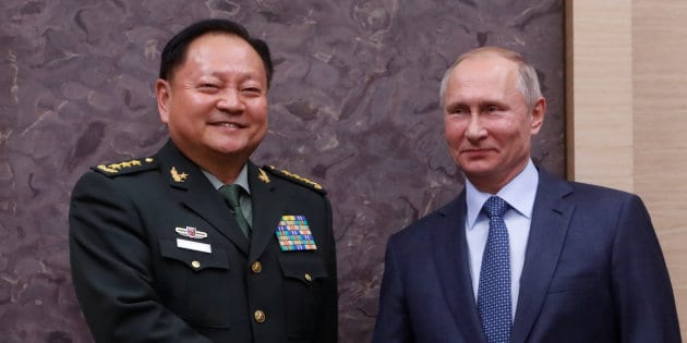 Russian President Vladimir Putin meets with China's Central Military Commission Vice Chairman Zhang Youxia at the Novo-Ogaryovo state residence outside Moscow