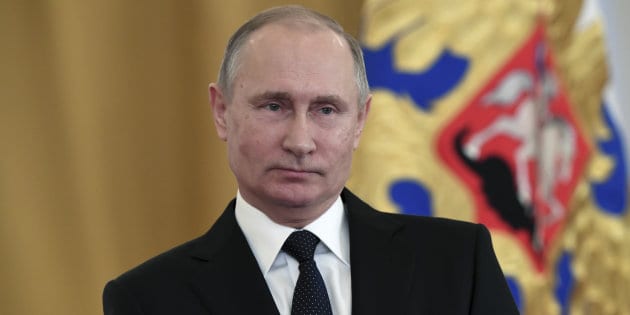 Russian President Vladimir Putin attends a state awards ceremony for military personnel who served in Syria, at the Kremlin in Moscow