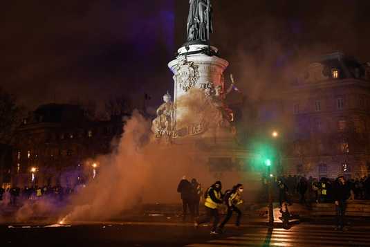 648x360_smoke-of-tear-gas-is-seen-as-protestors-including-some-wearing-a-yellow-vest-gilet-jaune-gather-on_536_357