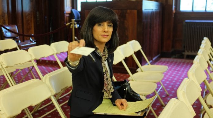 Judge Rachel Freier offers her business card in the ny city