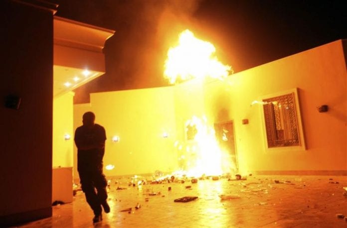 478474-a-protester-reacts-as-the-us-consulate-in-benghazi-is-seen-in-flames