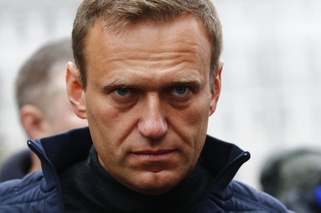 Alexei Navalny unconscious in hospital with suspected poisoning