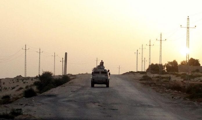 1055024-file-photo-an-egyptian-military-vehicle-is-seen-on-the-highway-in-northern-sinai