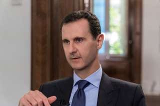 Syrian President Bashar al-Assad attends an interview with Russian television channel NTV