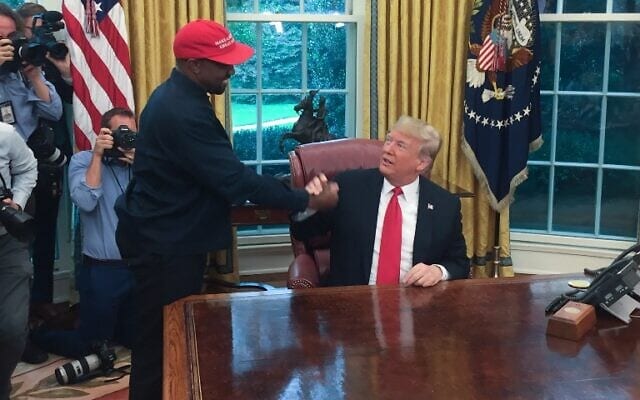 Trump hosts lunch for the rapper Kanye West, with the pair due to discuss issues including gun violence and prison reform