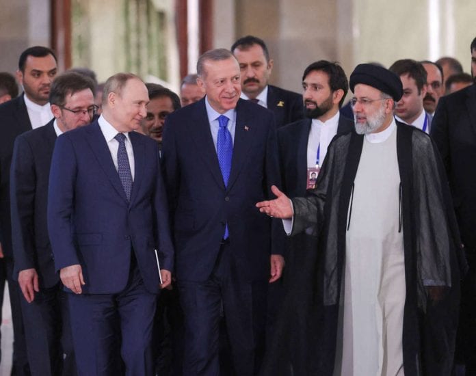 Presidents Putin of Russia, Raisi of Iran and Erdogan of Turkey arrive at a news conference in Tehran