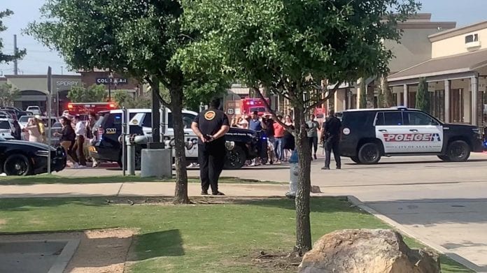 People exit Allen Premium Mall after shooting, in Allen