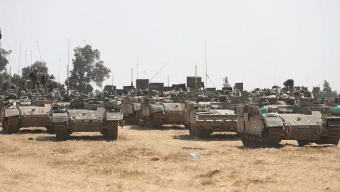 Israeli forces gather at Israel-Gaza border near southern Palestinian city of Rafah