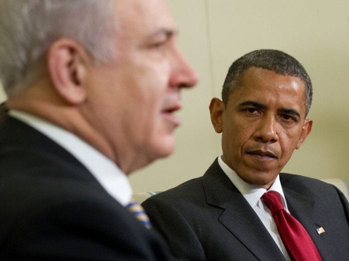 US President Barack Obama smiles alongsi