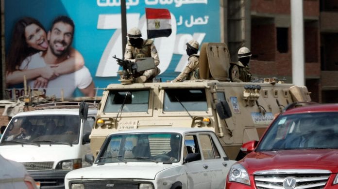 Army soldiers patrol on the Cairo-Alexandria desert road before the funeral of victims of the Palm Sunday bombings of Egyptian Coptic churches, in Cairo