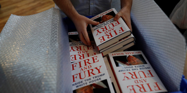 A shop worker unpacks copies of Michael Wolff's book 'Fire And Fury' as they go on sale inside a branch of the Waterstones book store in Liverpool, Britain.