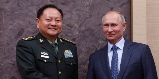 Russian President Vladimir Putin meets with China's Central Military Commission Vice Chairman Zhang Youxia at the Novo-Ogaryovo state residence outside Moscow