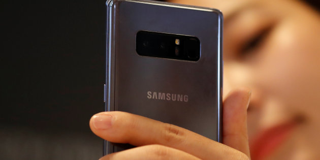 An employee demonstrate a Samsung Electronics' Galaxy Note 8 during its launching ceremony in Seoul