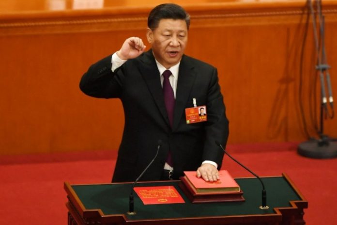 1105665-le-president-chinois-xi-jinping-prete-serment-apres-avoir-ete-reelu-le-17-mars-2018-a-pekin