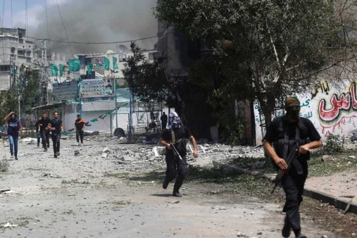 7773322601_des-combattants-du-hamas-dans-le-quartier-de-chajaya-a-gaza-le-20-juillet-2014_846_564