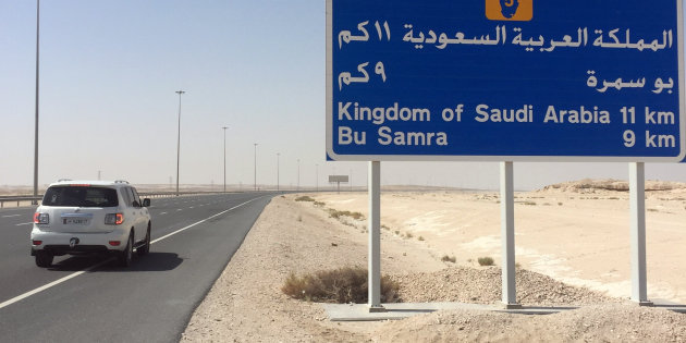 A road sign is seen near Abu Samra border crossing to Saudi Arabia