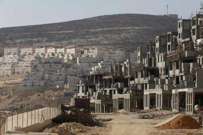 613054-a-construction-site-is-seen-in-jewish-settlement-near-jerusalem_956_637