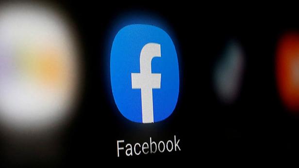 FILE PHOTO: A Facebook logo is displayed on a smartphone in this illustration