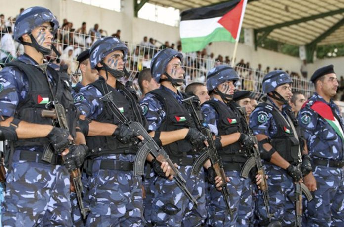 Members of Palestinian security forces take part in graduation ceremony in Jericho