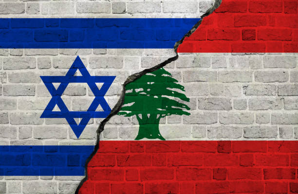 Israel and Lebanon flags together. Israel and Lebanon conflict.