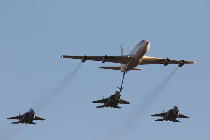 An-IAF-Boeing-707-and-three-F-15s-demonstrate-mid-air-refueling.-696x464